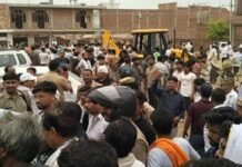 Unnao : साधु हत्याकांड के बाद अवैध निर्माण पर चला बुलडोजर